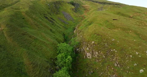 Flying in a gorge on the side of hill Video stock 312361199