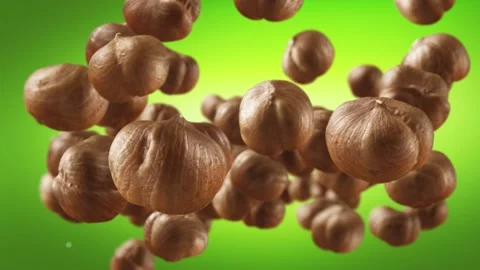 Flying of Hazelnuts in Green Background Stock Footage 145583906