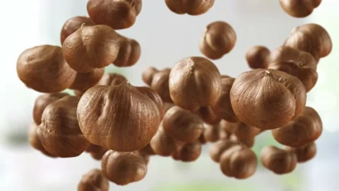 Flying of Hazelnuts in Kitchen Background Stock Footage 145583187