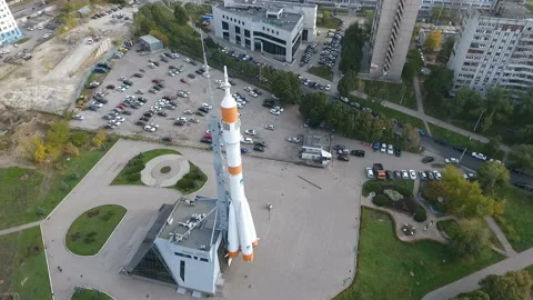 Flying at the height of the monument to the Soyuz rocket Stock Footage 98669984