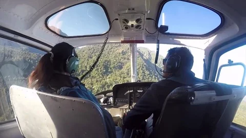 Flying a helicopter to the Franz Josef Glacier in New Zealand Stock Footage