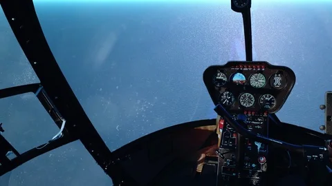 Flying a helicopter over the ocean during the day 스톡 동영상 73685374