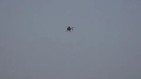 Flying helicopter in the sky Stock Footage 108589261