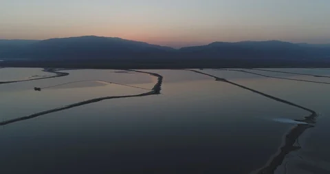 Flying high above the Dead Sea towards Jordan at beautiful sunrise 4K Stock Footage 106340887