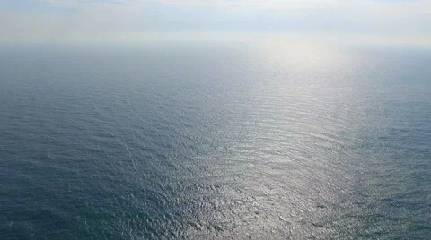 Flying high above the ocean on a bright sunny day Stock Footage 63090769