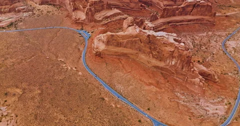 Flying high above the road going round the stunning rocks in Bryce canyon. Stock Footage 212123382