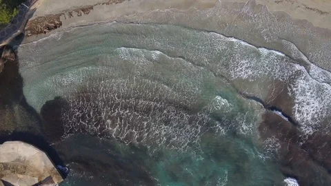 Flying high above turquoise waves and large beach 스톡 동영상 101281481