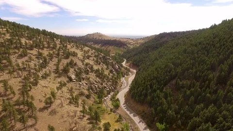 Flying High Over Mountain Road Color Corrected Stock Footage 100209445