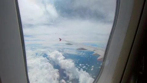 Flying high in the sky from airplane window view Stock-Footage 293774597