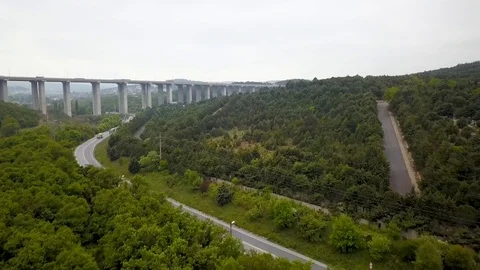Flying to highway bridge in forest Stock Footage 102664741