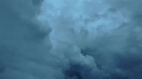 Flying Inside a Threatening Storm Clouds in a Gloomy Sky Through the Pilot’s Stock Footage 320999066