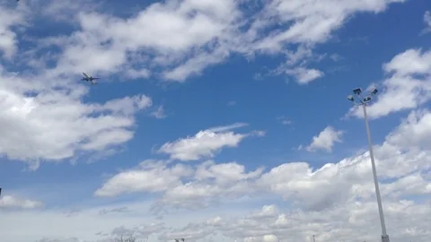 Flying Jet in Cloudy Sky Stock Footage 75432935
