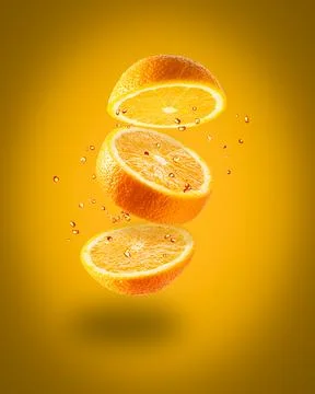 Flying juicy orange on a white background Stock Photos