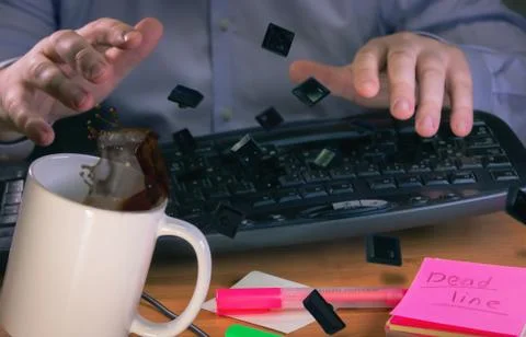 Flying keys from hard knocks on the keyboard Stock Photos