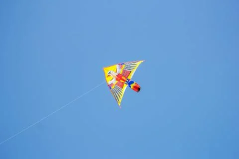 Flying kite in blue sky Stock Photos