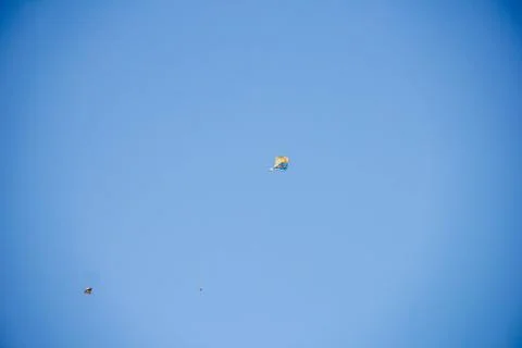 Flying kite in blue sky Stock Photos