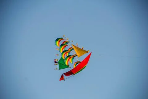 Flying kite in blue sky Stock Photos