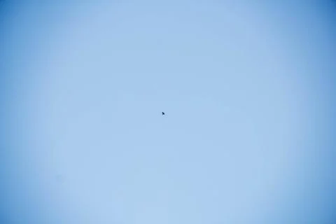 Flying kite in blue sky Stock Photos