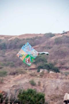 Flying kite in blue sky Stock Photos