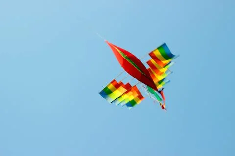 Flying kite in blue sky Stock Photos
