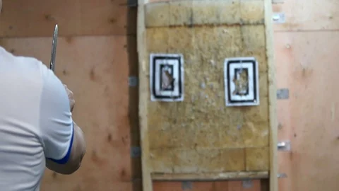 Flying knife. Man is throwing the knife. Tournament. Knife throwing Stock Footage 89286189