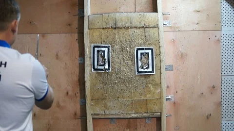 Flying knife. Man is throwing the knife. Tournament. Knife throwing Stock Footage 89324004