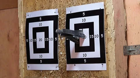 Flying knife. Man is throwing the knife. Tournament. Knife throwing Stock Footage 89602376