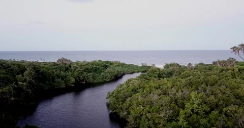 Flying from a lagoon to the Indian ocean. Stock Footage 107820331