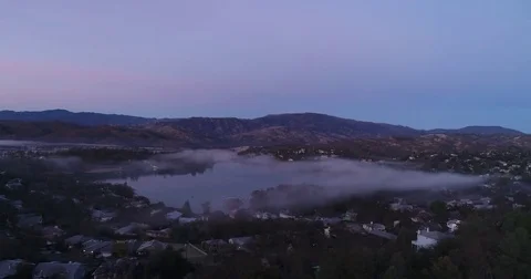 Flying into Lake with Clouds at Dawn Stockbeeldmateriaal 83859836
