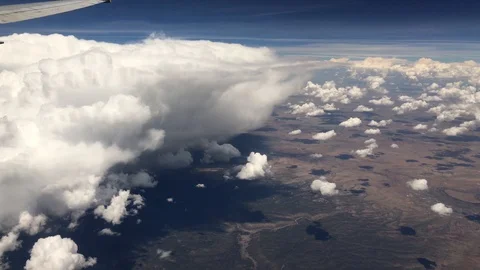 Flying By Large Cloud-View from Commercial Jet Stock Footage 91315587