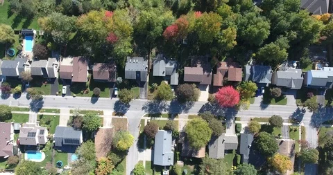 Flying Left Over Rows Of Houses With Autumn Forest And Trees Aerial Stock Footage 97397247