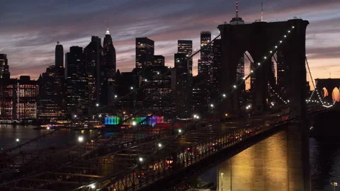 Flying left view of Brooklyn Bridge and downtown NYC sunset Stock Footage 196517466
