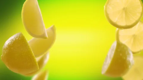 Flying of Lemon and Slices in Lime Green Background Stock Footage 123500568