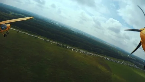 Flying in a light airplane. The camera is attached to the wing of the aircraft Stock Footage 73671745