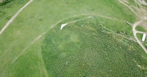 Flying on a light hang glider. Shooting from a drone, top view. Stock Footage 109883176