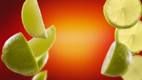 Flying of Lime and Slices in Red Background Stock Footage 123500921