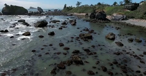 Flying low above rocks along Northern California coastline Video stock 73098541