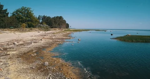 Flying low along coastline Stock Footage 90758467
