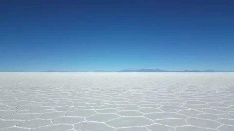 Flying low and straight over the Uyuni salt flats in Bolivia Stock Footage 285897427