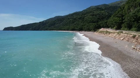 Flying low with drone next to shore Stock Footage 255097882