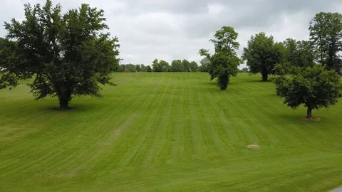 Flying Low Elevation Drone Aerial Shot Sweeping Across a Park, 4K Drone Aerial 스톡 동영상 93758249