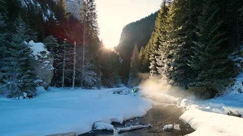 Flying low near a river stream with steam coming up from the water Stock Footage 296696803