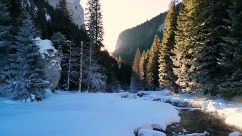 Flying low near a river stream with steam coming up from the water in the winter Stock-Footage 296696829