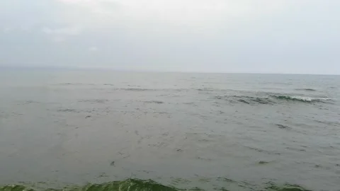 Flying low out across the waves of Lake Michigan Stock Footage 142177680