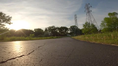 Flying low over an asphalt track outside the city Stock Footage 300043049