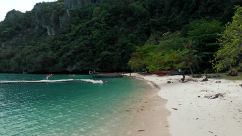 Flying low over the breaking waves along the beach. Aerial shot paradise Stock Footage 236163221