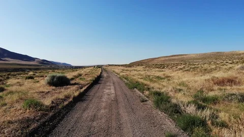 Flying Low over a Desert Dirt Road in Nevada - Aerial Drone Stock Footage 112635338