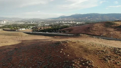 Flying Low Over Hillside Towards Downtown Reno Nevada - Aerial Drone Stock Footage 198634692