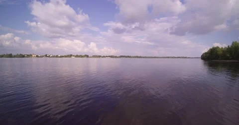 Flying low over the river water and take off Stock Footage 66879585