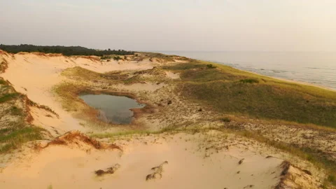 Flying low over sand dunes in Ludington State Park, Michigan, United States. Stock Footage 157484079